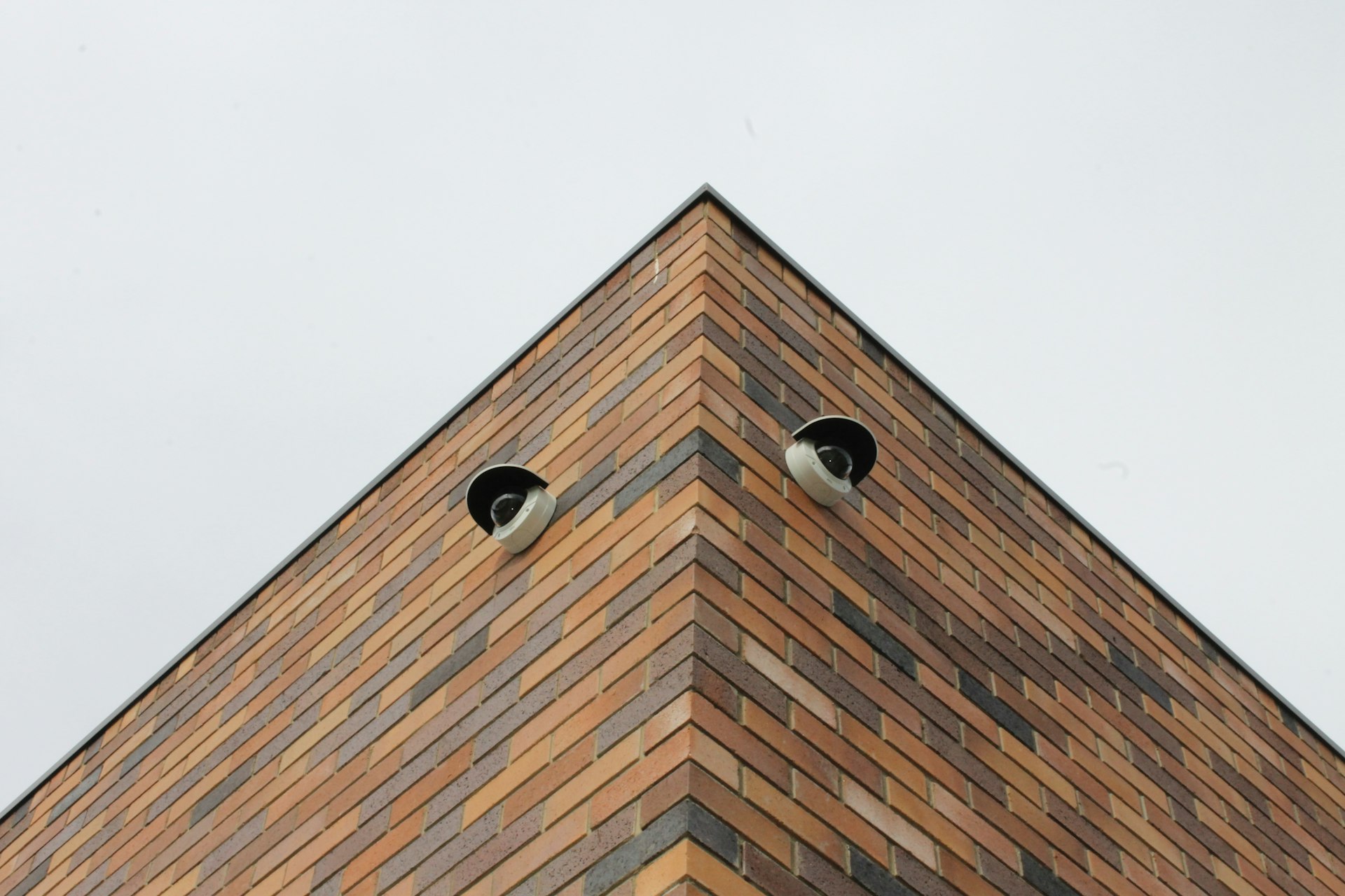brown brick building under white sky during daytime